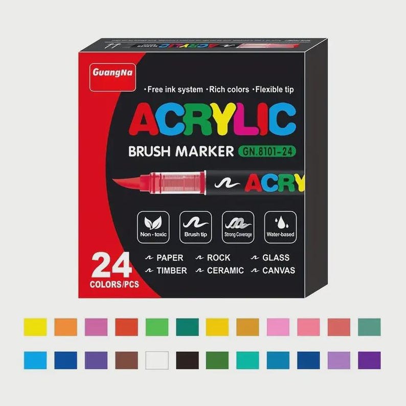 May include: A black box of GuangNa acrylic brush markers, GN.8101-24, with 24 colors. The box features the word "ACRYLIC" in large, colorful letters, and a red brush marker illustration. The box also lists features like "non-toxic" and "water-based".