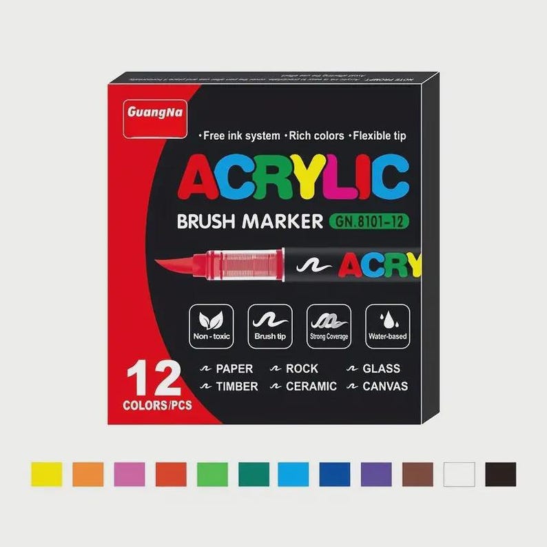 May include: A black and red box of GuangHa acrylic brush markers. The box features the word "ACRYLIC" in large, colorful letters. The box indicates the markers are water-based, non-toxic, and suitable for paper, rock, glass, timber, ceramic, and canvas. The box contains 12 colors.
