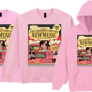 May include: Three pink garments: a t-shirt, a sweatshirt, and a hooded sweatshirt. Each features a graphic with the text "THIS TOUR MAY CONTAIN NEW MUSIC" and images of a woman, musical notes, and the word "MUSICAL".
