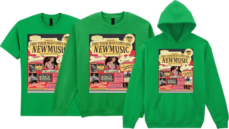May include: Green t-shirts, a sweatshirt, and a hoodie featuring a colorful graphic. The graphic reads "THIS TOUR MAY CONTAIN NEW MUSIC" with images of a woman, musical notes, and the word "MUSICAL".