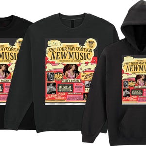 May include: Three black shirts: a t-shirt, a long-sleeve shirt, and a hooded sweatshirt. Each features a colorful graphic with the text "THIS TOUR MAY CONTAIN NEW MUSIC" and images of a woman, musical notes, and the word "BRASS".