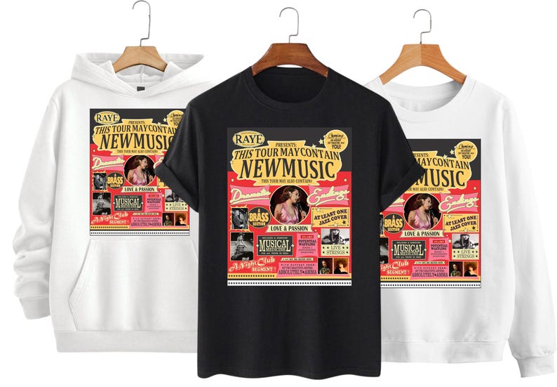 May include: Three garments: a white hoodie, a black t-shirt, and a white sweatshirt. Each features a concert poster design with the text "RAYE PRESENTS THIS TOUR MAY CONTAIN NEW MUSIC". The design includes images and text.