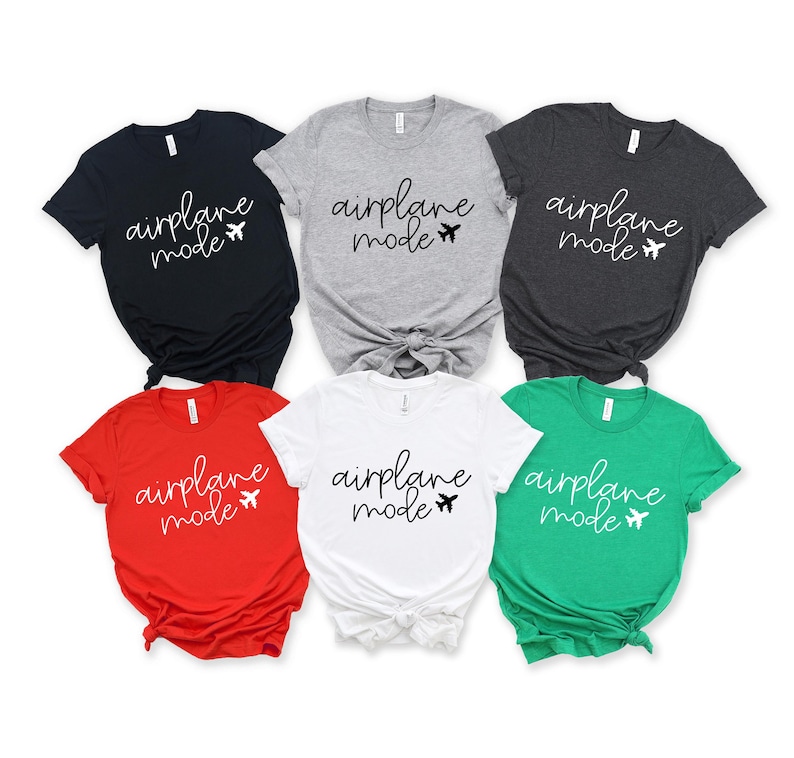a collection of six t-shirts, each with the text "airplane mode" printed on them in different colors and styles.