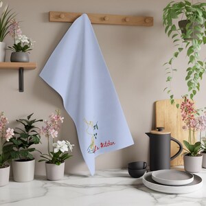 Personalized tea towel displayed beside marble counters and brass fixtures, floral kitchen accessory, luxury farmhouse textile, elegant homemaking decor, cozy culinary accent, hostess gift idea, bridal registry essential, baking enthusiast companion, cotton absorbent cloth, neutral apartment styling, sophisticated countertop detail, chic domestic furnishing, modern kitchen decor, cottagecore accessory, gourmet entertaining essential, timeless linen textile, decorative household accent