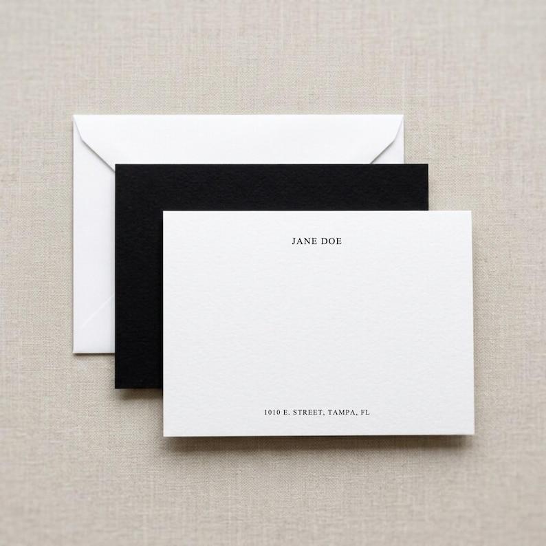 Minimalist custom flat note card set with matching envelopes displayed in a clean neutral flat lay, personalized stationery mockup featuring elegant black and white correspondence cards, luxury thank you note set, custom monogram note cards, modern personalized stationery gift, professional business correspondence cards, wedding thank you stationery, bespoke writing set, premium blank folded cards with envelopes, aesthetic desk stationery product photo, high end paper goods mockup for Etsy