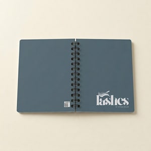 Open spiral notebook mockup displaying “Add Your Logo” on the right-hand page. Text mentions choosing small, medium, or large logo sizes in personalization box. Example shows that all designs are sent for approval before production. Ideal for businesses ordering branded stationery, team journals, and promotional gifts. Custom notebook for professional branding and personalized office products.