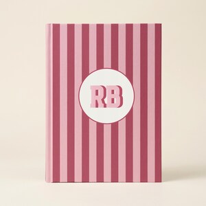 Versatile Writing Journal Personalized Notebook Design Custom Initial Feature Monogrammed Circular Detail Student Note Taking Essential Professional Meeting Companion Daily Planning Tool Elegant Striped Pattern Perforated Pages