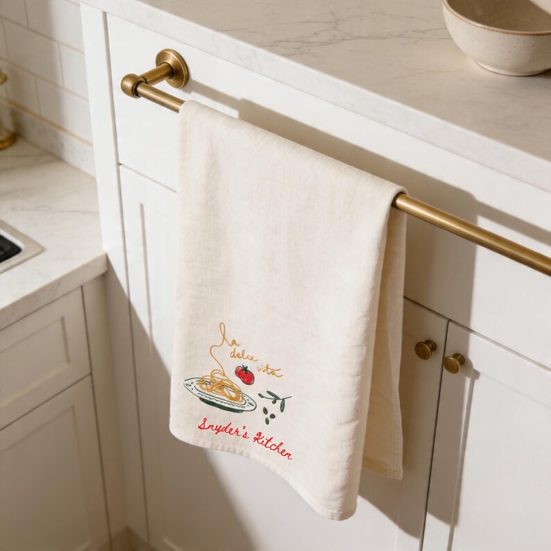 Personalized kitchen tea towel hanging on oven handle, custom housewarming gift, elegant hostess present, neutral farmhouse kitchen decor, embroidered hand towel, bridal shower keepsake, realtor closing gift, newlywed home essential, thoughtful apartment warming surprise. Ideal for holiday hosting, Airbnb styling, baking lovers, dinner party decor, luxury linen accents, anniversary presents, everyday kitchen organization, and refined home interior upgrades.
