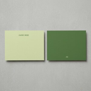 Personalized sage green flat note cards with matching envelopes shown in a minimalist neutral flat lay, elegant custom stationery set featuring modern correspondence cards, monogram writing paper, thank you note set, premium personalized paper goods, wedding stationery gift, luxury boxed note cards, aesthetic office desk stationery, custom folded cards with envelopes, sophisticated everyday correspondence set, muted green stationery gift for women, refined paper product mockup for Etsy listing