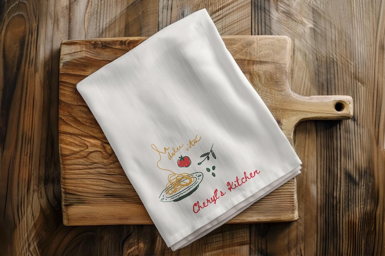Luxury kitchen towel hanging from brass oven handle inside elegant neutral farmhouse interior, personalized linen cloth, hostess appreciation present, wedding registry accessory, bridal shower favorite, cottagecore decoration, gourmet cooking accent, holiday entertaining essential, grandmother keepsake, rustic culinary styling, minimal aesthetic textile, housewarming surprise, baker companion, chef inspired fabric, decorative drying cloth, upscale apartment decor, cream cotton material