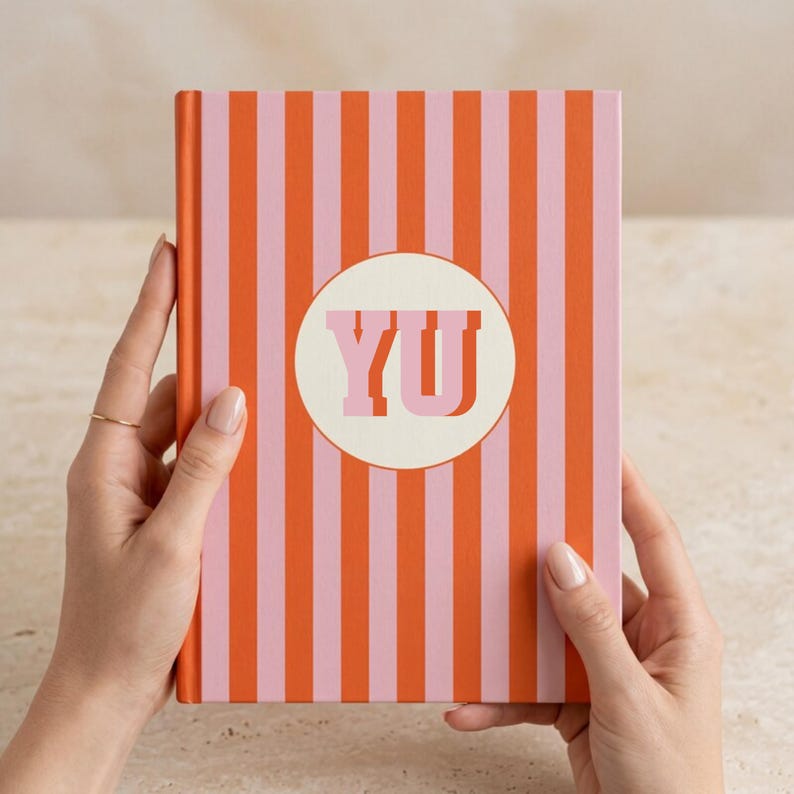 Orange and pink striped personalized notebook with custom initials printed on the front. Stylish monogrammed journal with lined perforated pages for writing, planning, or work notes. Aesthetic hardcover diary perfect for students, professionals, and creative writers. Custom name notebook for office, school, or journaling. Vibrant orange stripe stationery gift idea for teachers, coworkers, or friends who love unique personalized notebooks.