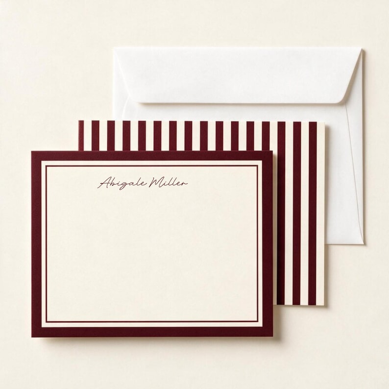 Personalized burgundy bordered notecard with full name in script font, layered with a matching burgundy striped card back and a plain white envelope.

Personalized burgundy notecard set, script name stationery, burgundy striped card design, custom name flat card with envelope, elegant personalized note set