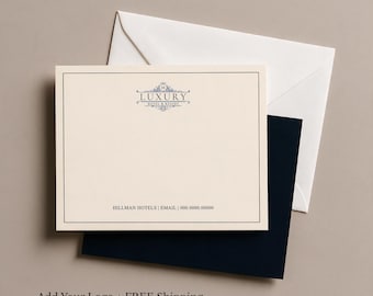 May include: A cream-colored stationery card with a thin black border, featuring the text LUXURY HOTEL & RESORT with a decorative emblem at the top and HILLMAN HOTELS | EMAIL | 000.0000.00000 at the bottom, paired with a white and a dark blue envelope.