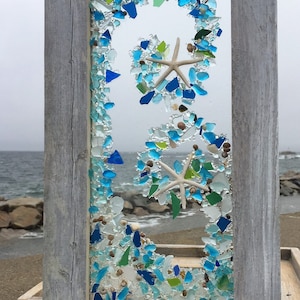 Beach glass panel in bright tones in a wave pattern with starfish