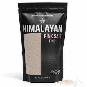 May include: A black bag of Himalayan pink salt with a clear window showing the fine salt. The bag has white text that reads "Himalayan Pink Salt Fine". The bag is labeled "100% Pure, Natural & Unrefined" and weighs 2.2 lbs (1 kg).