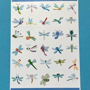 May include: A sheet of stickers featuring various cartoon dragonflies in different colors and designs. The stickers are labeled "Tiny Dragonflies" at the top and "Party Loft Stickers" at the bottom.