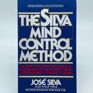 May include: A vintage book titled "The Silva Mind Control Method" with a blue cover and white and gold lettering. The book's cover includes the text "Transforming Lives Everywhere!" and the author's name, José Silva.