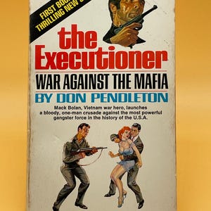 May include: Vintage paperback book cover for "The Executioner: War Against the Mafia" by Don Pendleton. The cover features illustrations of a man with a gun, and a scene of a man holding a woman. The book is part of a thrilling new series.