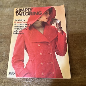 May include: A vintage book cover titled "SIMPLY TAILORING" featuring a woman in a red coat with a hood. The cover includes text about tailoring techniques and the price of $1.00.