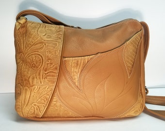 tan cowhide  leather shoulder, crossbody bag with embossed accents