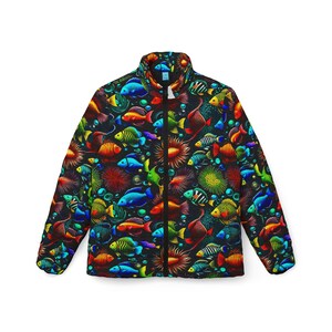 May include: A black puffer jacket featuring a vibrant, all-over print of colorful fish, coral, and bubbles. The jacket has a high collar and a full-length zipper. The fish are in shades of blue, orange, yellow, and green.