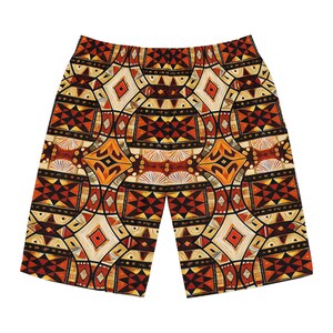 May include: A pair of shorts featuring a complex geometric pattern in shades of burnt orange, deep red, black, and cream. The design consists of repeating diamond shapes, star motifs, and intricate linear details across the entire fabric surface.