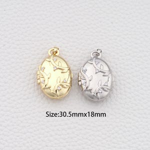May include: Two oval-shaped lockets, one gold-toned and one silver-toned, with floral and crystal accents. The lockets are approximately 1.2 inches long and 0.7 inches wide. The image includes the text "Size: 30.5mmx18mm".