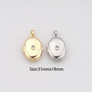 May include: Two oval-shaped locket pendants, one gold-toned and one silver-toned, each with a small, clear gemstone. The pendants are approximately 1.2 inches long and 0.7 inches wide. The image includes the text "Size: 31mmx18mm".