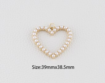 May include: A gold-colored heart-shaped pendant, outlined with small, white pearls. The pendant has a small loop at the top for hanging. The text "Size: 39mmx38.5mm" is below the pendant.