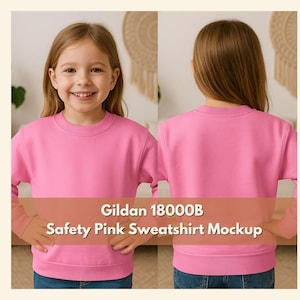 May include: A front and back view of a young person wearing a safety pink Gildan 18000B sweatshirt. The sweatshirt is a crew neck style with long sleeves. The text "Gildan 18000B Safety Pink Sweatshirt Mockup" is displayed across the bottom.