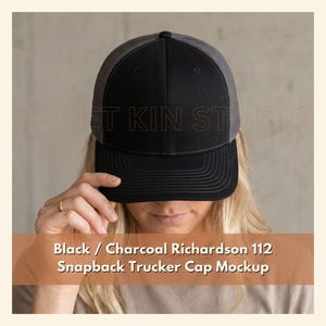 May include: A black and charcoal gray snapback trucker cap featuring a solid black front panel and a charcoal gray mesh back. The cap includes the text Black / Charcoal Richardson 112 Snapback Trucker Cap Mockup printed on the lower portion.
