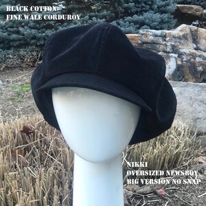 May include: Black cotton fine wale corduroy newsboy cap.  Nikki oversized newsboy big version no snap.