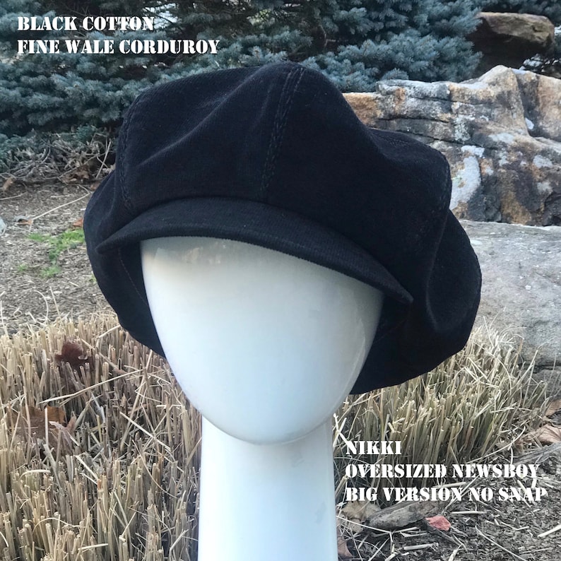 May include: Black cotton fine wale corduroy newsboy cap.  Nikki oversized newsboy big version no snap.