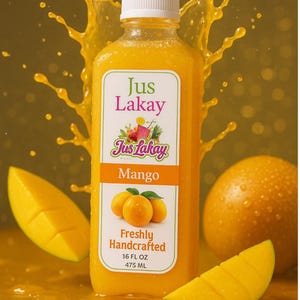 May include: A bottle of "Jus Lakay" mango juice with a white cap, surrounded by mango slices and a splash of juice. The label reads "Mango" and "Freshly Handcrafted", with a volume of 16 fl oz (475 mL).