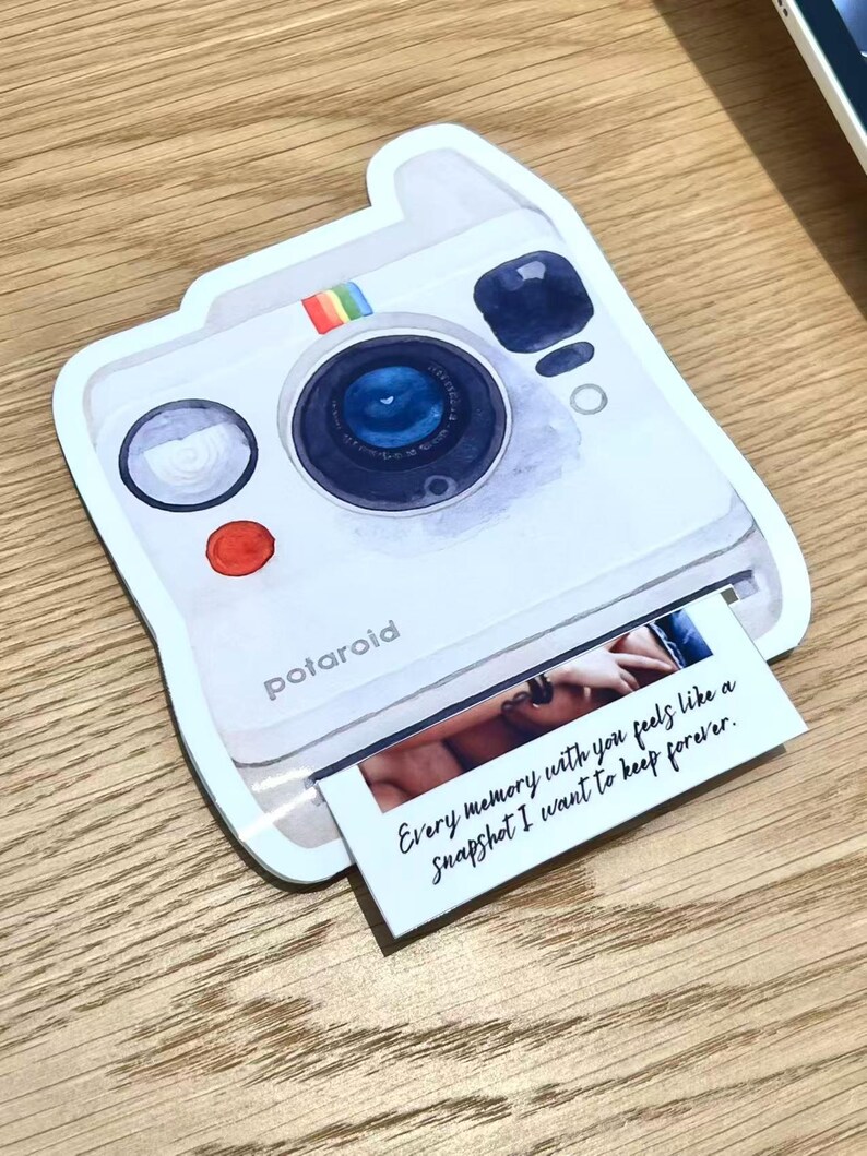 May include: A white Polaroid-style sticker with a rainbow stripe and the word "polaroid". The sticker has a photo print with the text "Every memory with you feels like a Snapshot I want to keep forever."