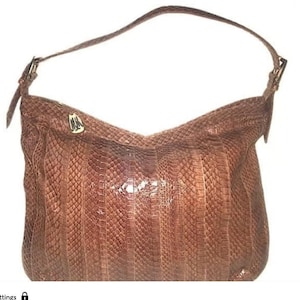 May include: A trio of ceramic mugs with a speckled, matte finish in cream, light grey, and dark grey. Each mug features a simple, minimalist design, ideal for tea or coffee.