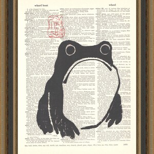 May include: A black and white illustration of a frog on a vintage dictionary page. The frog is sitting on the word "wheel" and the page includes definitions for "wharf boat", "what", and "wheat".