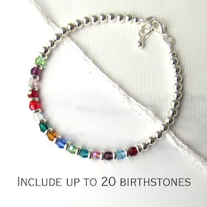 May include: Silver beaded bracelet with colorful birthstones. The bracelet features a mix of vibrant gemstones, including red, green, blue, and purple. The text "Include up to 20 birthstones" is displayed below the bracelet.