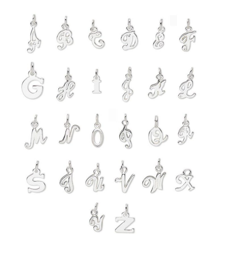 May include: A set of 26 silver charm pendants, each featuring a different letter of the alphabet in a cursive script style.