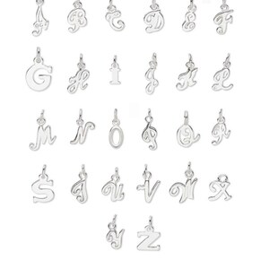 May include: A set of 26 silver charm pendants, each featuring a different letter of the alphabet in a cursive script style.