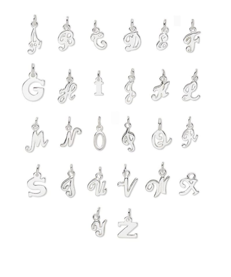 May include: A set of 26 silver charm pendants, each featuring a different letter of the alphabet in a cursive script style.