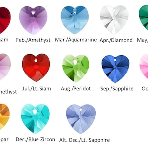 May include: Chart of heart-shaped crystals with the month and corresponding birthstone name.  January/Siam, February/Amethyst, March/Aquamarine, April/Diamond, May/Emerald, June/Light Amethyst, July/Light Siam, August/Peridot, September/Sapphire, October/Rose, November/Topaz, December/Blue Zircon, Alternate December/Light Sapphire.