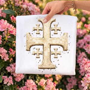 May include: White square textile featuring a gold Jerusalem cross design. The cross is textured with a central cross and four smaller crosses in each quadrant. The design has a distressed, aged appearance with dark speckles.