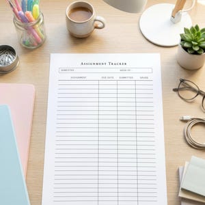 May include: A white assignment tracker sheet with black text and grid lines. The header reads Assignment Tracker with fields for semester, week of, assignment, due date, submitted, and grade. The document is centred on a light wood desk surface.
