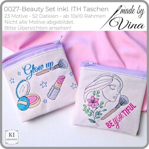 Könnte beinhalten: Zwei kleine, cremefarbene Kosmetiktaschen mit lavendelfarbenen Reißverschlüssen. Eine Tasche zeigt gestickte Make-up-Artikel und die Worte "Glow Up". Die andere Tasche hat ein Frauengesicht, Blumen, einen Make-up-Pinsel und die Worte "Be You Tiful".