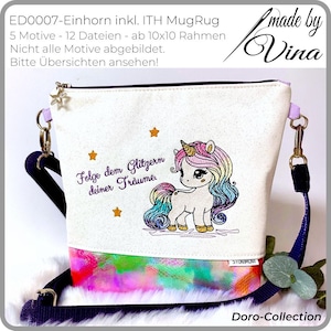 May include: A white canvas crossbody bag featuring a unicorn design and the text "Folge dem Glitzern deiner Träume." The bag has a colourful bottom panel, a star-shaped zip pull, and a navy blue strap.