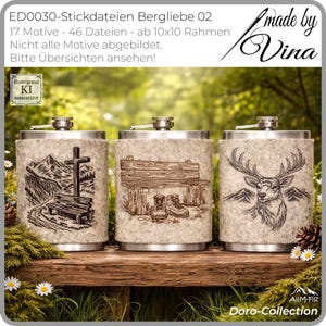 May include: Three stainless steel flasks with felt covers featuring embroidered outdoor scenes. Designs include a cross and bench, a wooden shelter with boots, and a deer with mountains. The flasks are displayed on a wooden surface.