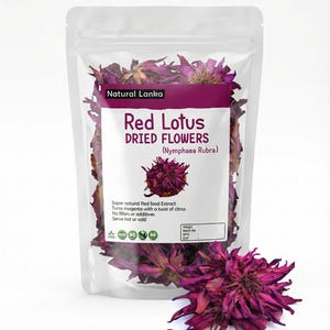 May include: A transparent bag containing dried red lotus flowers, labelled "Red Lotus Dried Flowers" with "Natural Lanka" and "(Nymphaea Rubra)". A single dried flower is placed in front of the bag. The flowers are a deep magenta colour.