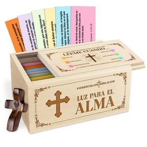 May include: A wooden box set with colourful Bible verse cards. The box has a cross design and the words "Luz Para El Alma" are visible. A wooden cross is attached to the side.