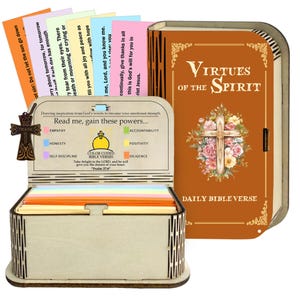 May include: A wooden box with a lid, containing colorful cards with Bible verses. The box is accompanied by a decorative wooden cross and a book-shaped container with the text "Virtues of the Spirit". The box has the text "Read me, gain these powers..."